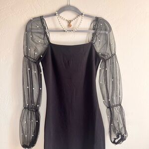 Chic Black Dress with Sheer Sleeves